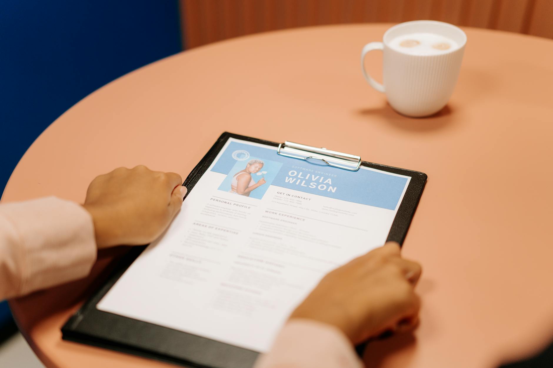 Professional reviewing an ATS-optimized resume created with Rezumea AI Resume Builder